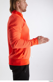 Erling  1 arm dressed flexing orange long sleeve t…